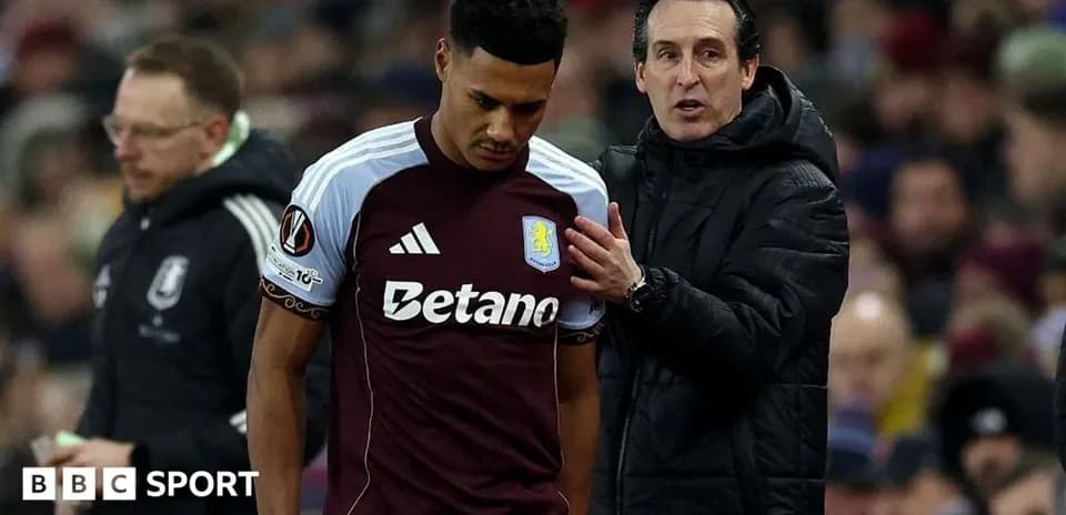 Entrenador hablando con jugador de Aston Villa en partido
