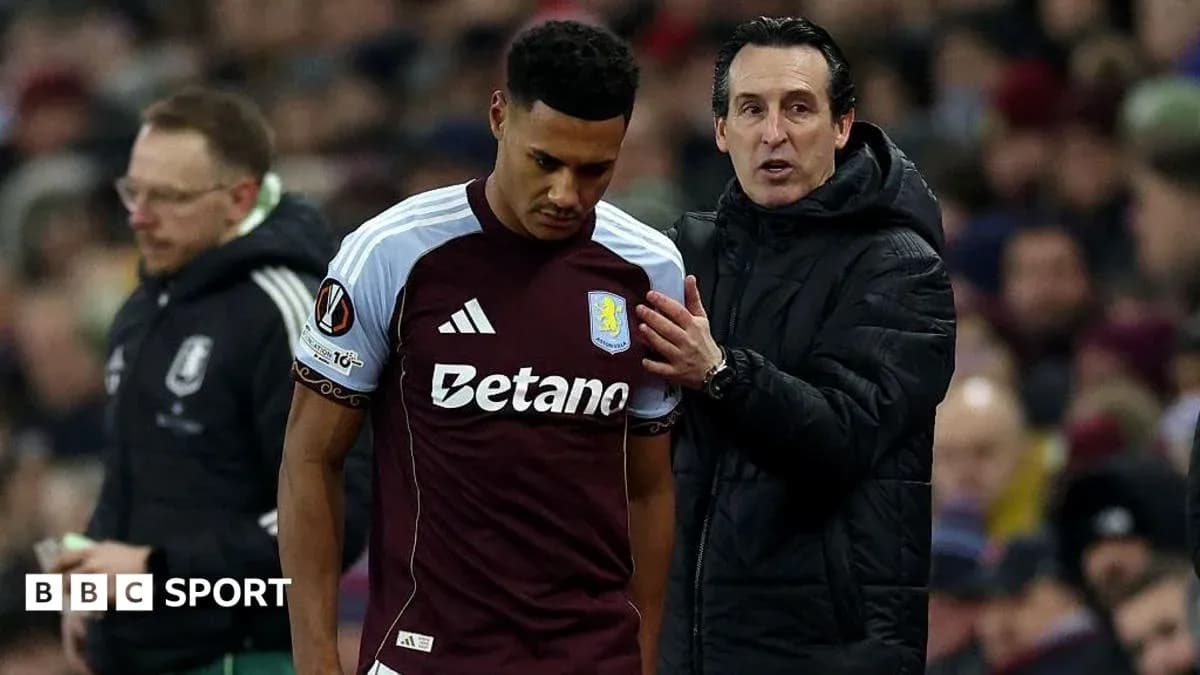 Entrenador hablando con jugador de Aston Villa en el partido