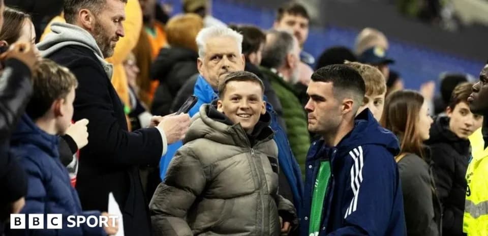 A crowd scene with fans interacting after a match