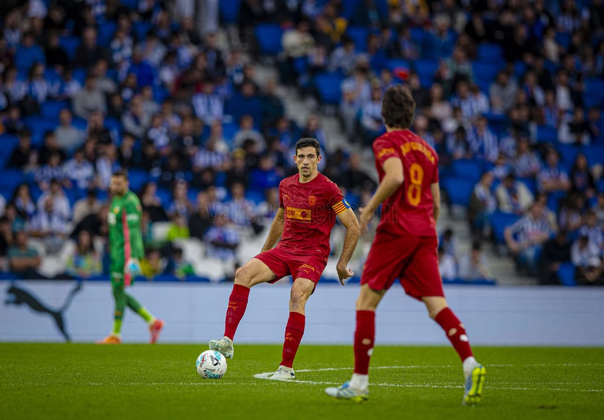 Jugadores de Valencia en partido de fútbol Jugadores de Valencia en partido de fútbol