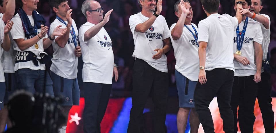 Celebration with team members wearing medals and T-shirts