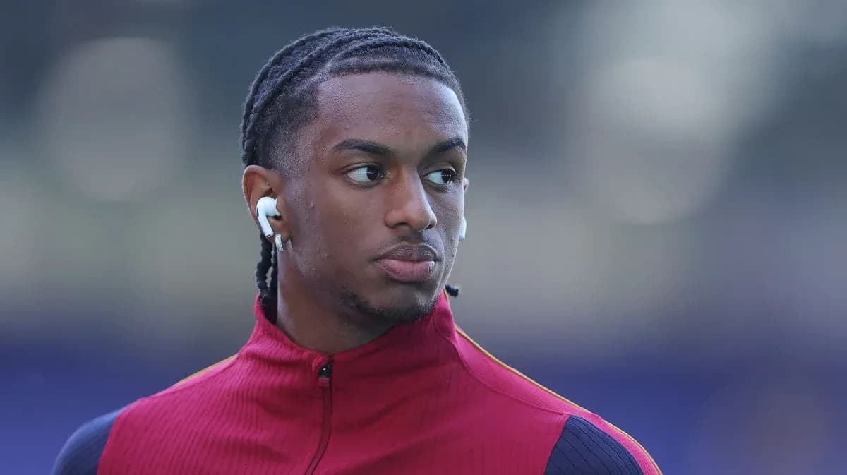 Jugador con auriculares en el calentamiento previo