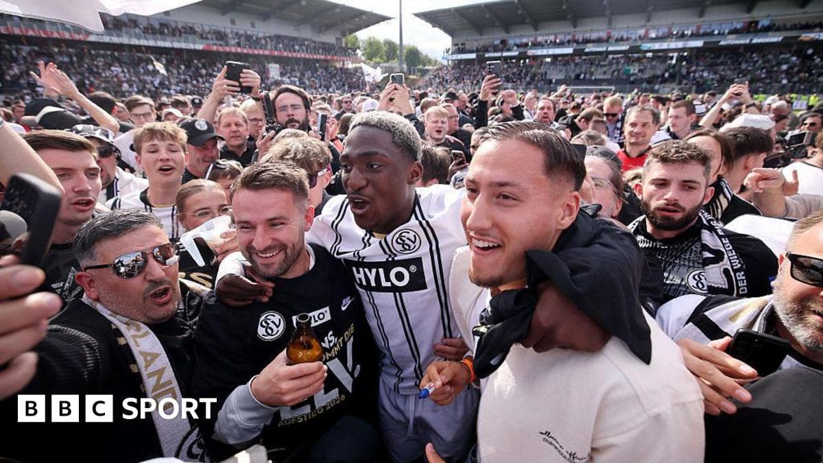 Agroup celebrating in crowd after match victory