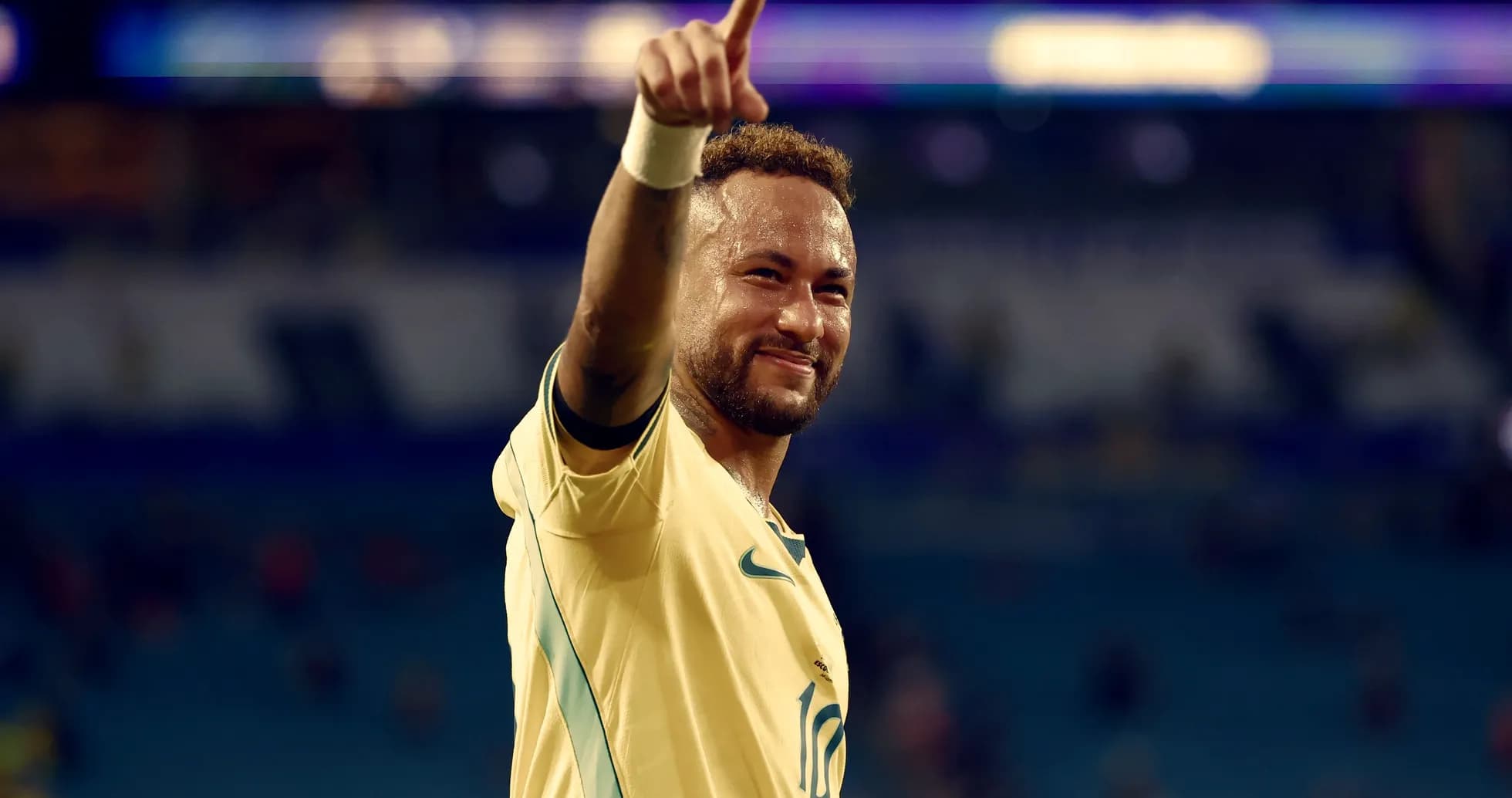 Jugador celebrando con el dedo señalando hacia arriba