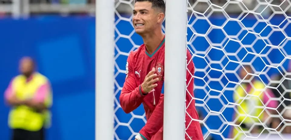 Cristiano Ronaldo celebrating near goalpost during match