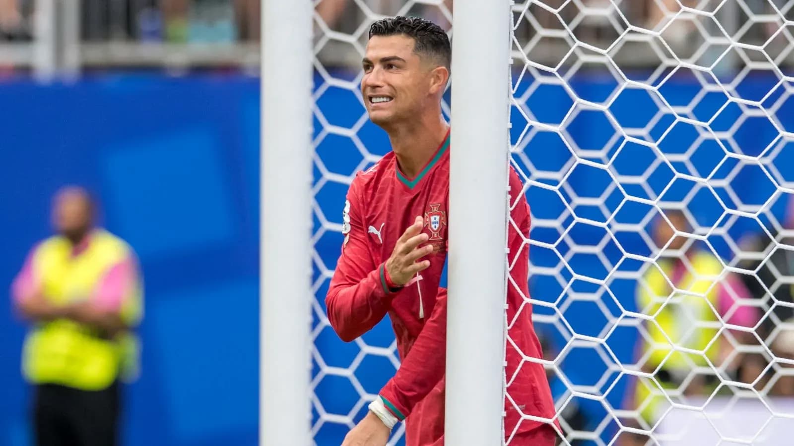 Cristiano Ronaldo celebrating near goalpost during match