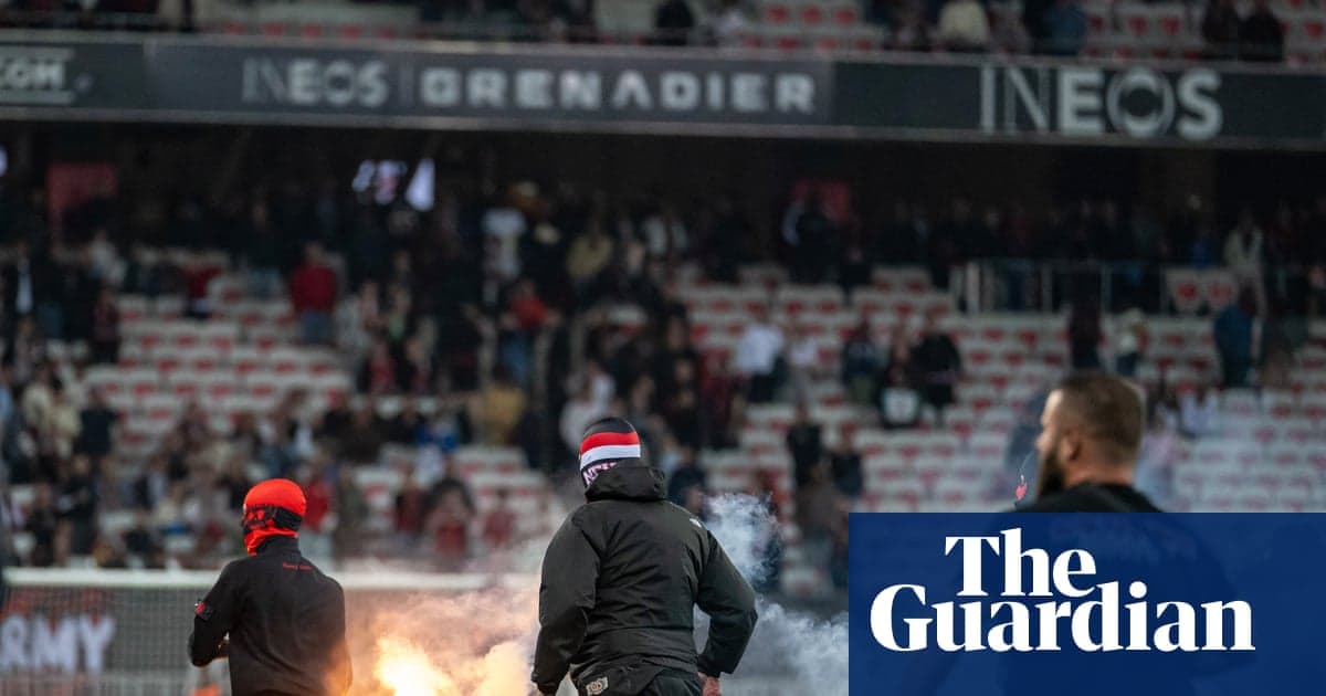 Aflare igniting in the stands during a match