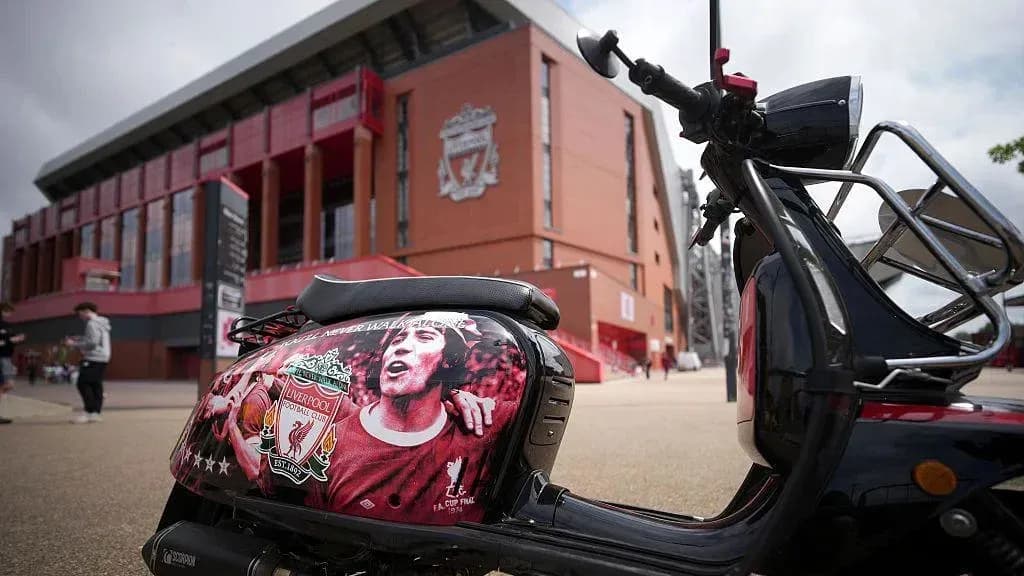 Scooter decorated with Liverpool FC emblem outside stadium