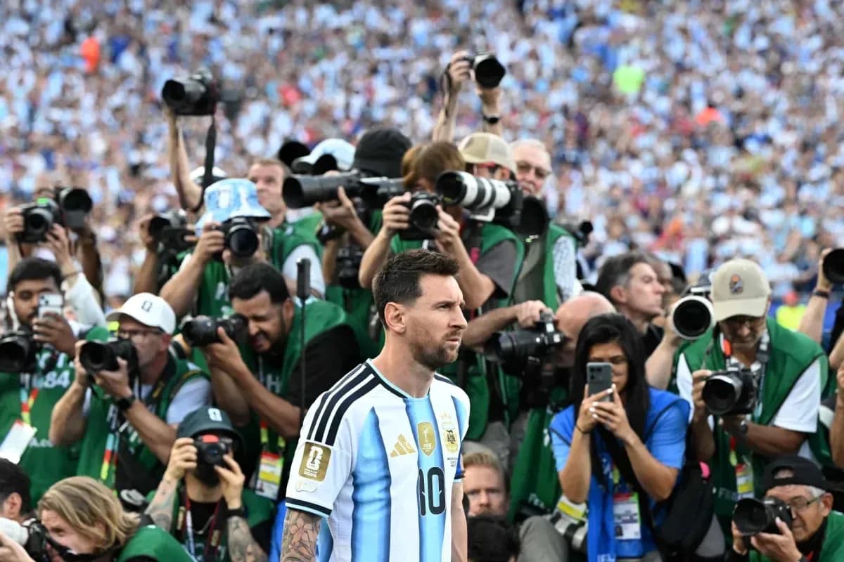 Lionel Messi surrounded by photographers on field Lionel Messi surrounded by photographers on field