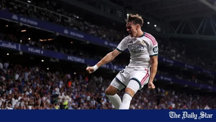 Jugador de Real Madrid celebrando un gol en el estadio Jugador de Real Madrid celebrando un gol en el estadio