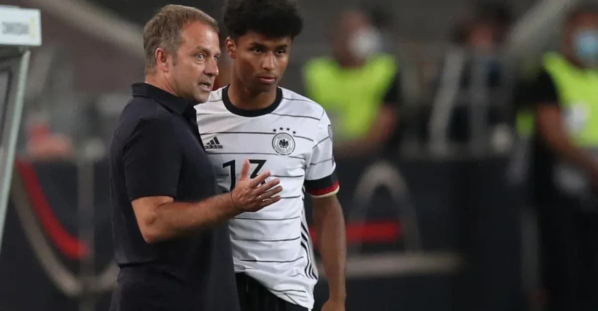 Entrenador hablando con jugador de Alemania en partido Entrenador hablando con jugador de Alemania en partido